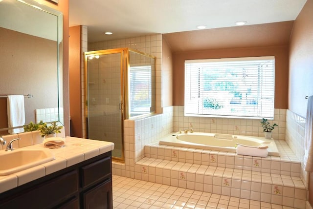 bathroom with separate shower and tub, tile patterned flooring, and vanity