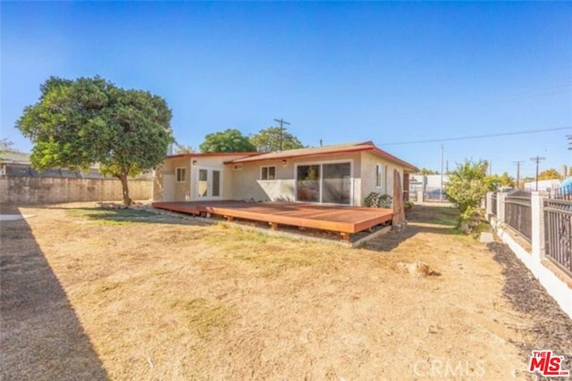 rear view of property with a deck