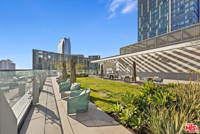 view of home's community with a yard, a patio, and outdoor lounge area