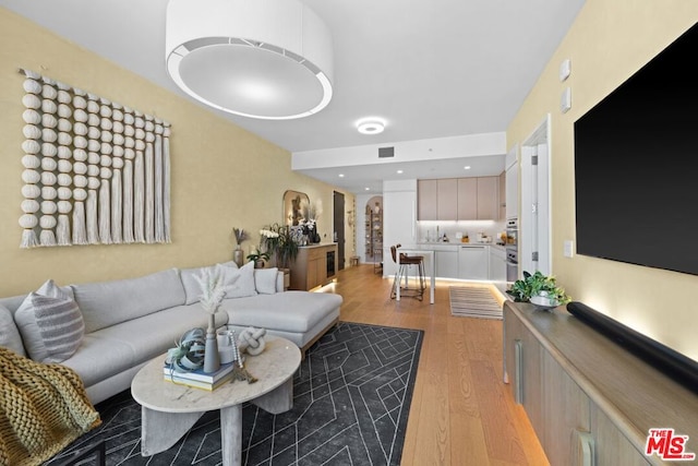 living room with light hardwood / wood-style floors