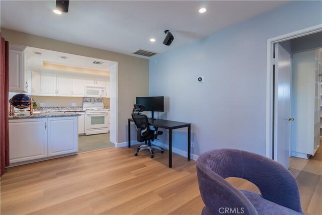 office area with light hardwood / wood-style flooring