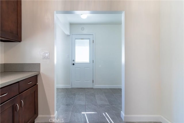 interior space with dark brown cabinetry