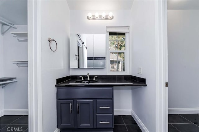 bathroom with tile patterned floors and vanity