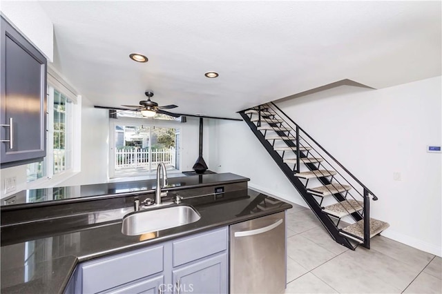 kitchen with gray cabinets, ceiling fan, light tile patterned flooring, dishwasher, and sink