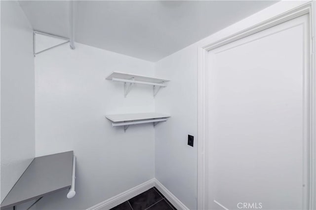 walk in closet featuring tile patterned flooring