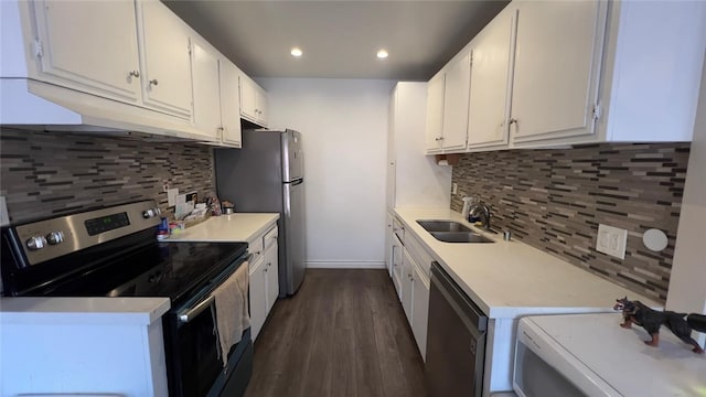 kitchen featuring tasteful backsplash, sink, white cabinets, stainless steel appliances, and dark hardwood / wood-style floors