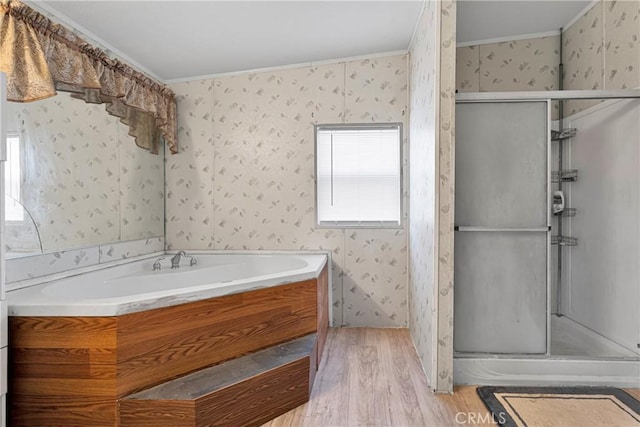 bathroom featuring wood-type flooring, separate shower and tub, a wealth of natural light, and crown molding