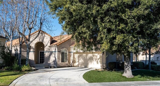 view of front of house featuring a front yard and a garage