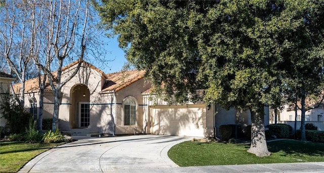 view of front facade with a garage and a front yard