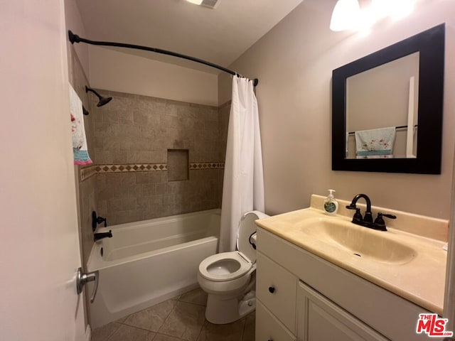 full bathroom with tile patterned floors, vanity, shower / bath combination with curtain, and toilet