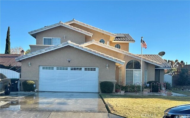 view of front of property with a garage and a front yard