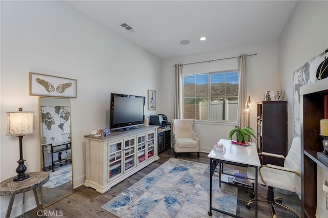 living area with hardwood / wood-style floors