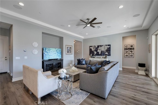 living room with hardwood / wood-style floors and ceiling fan