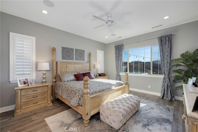 bedroom featuring ceiling fan and dark hardwood / wood-style floors