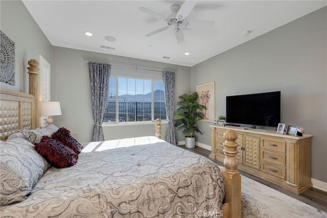 bedroom featuring dark hardwood / wood-style flooring and ceiling fan