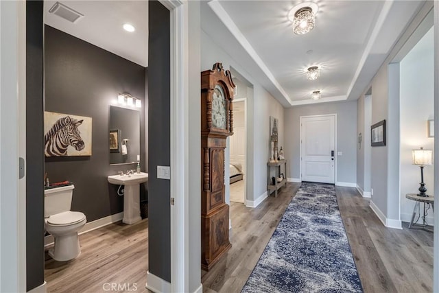 interior space with light hardwood / wood-style floors and sink