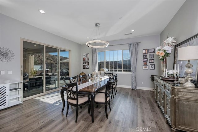 dining room with hardwood / wood-style floors