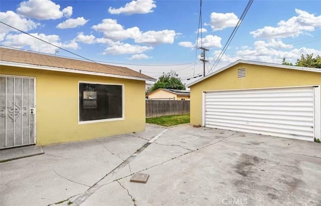 view of home's exterior with an outbuilding and a garage