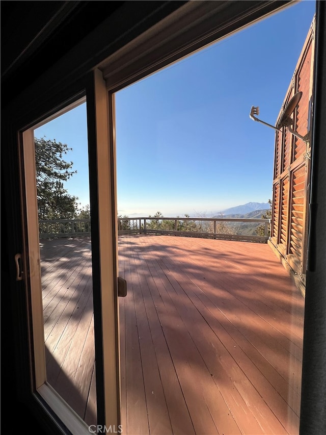 wooden deck with a mountain view