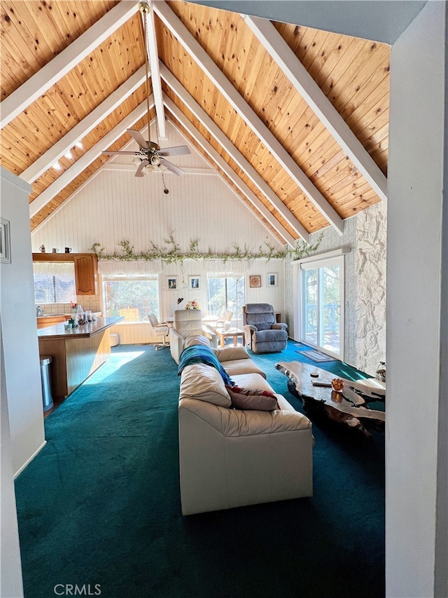 living room featuring ceiling fan, carpet, high vaulted ceiling, and beamed ceiling