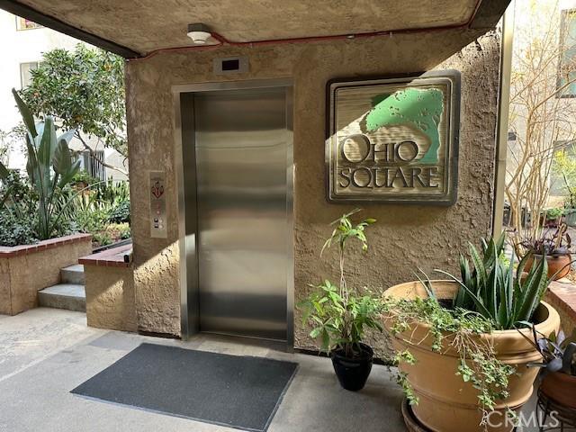 doorway to property with elevator