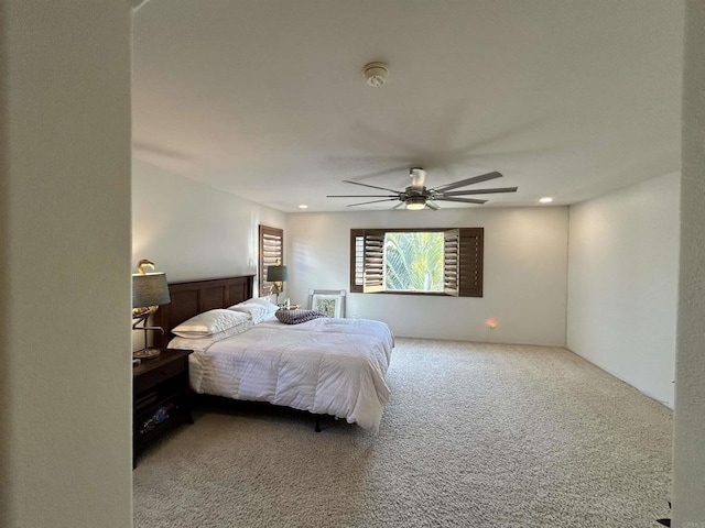 bedroom featuring ceiling fan and carpet floors