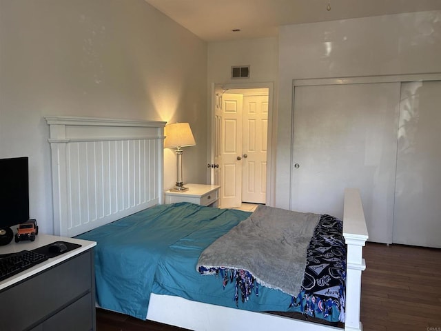 bedroom featuring dark hardwood / wood-style flooring