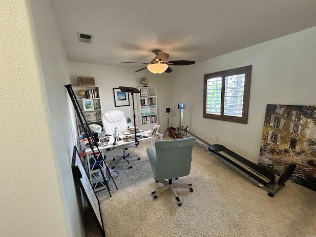 home office featuring carpet floors and ceiling fan