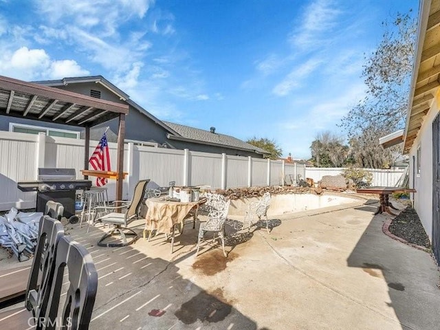 view of patio featuring a grill