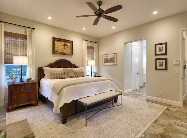 bedroom with connected bathroom and ceiling fan