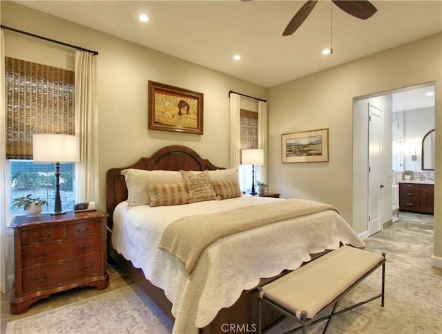 bedroom with ceiling fan and connected bathroom