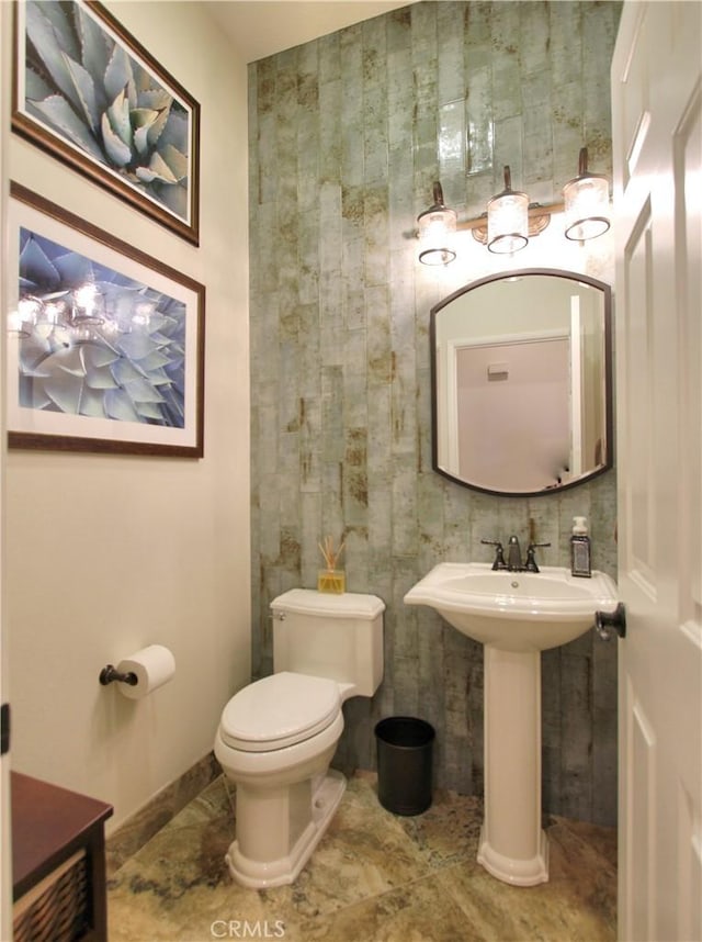 bathroom featuring toilet and sink