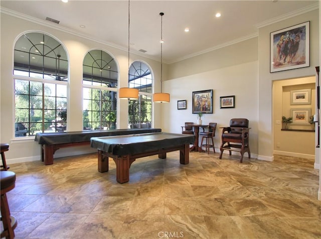 rec room featuring a healthy amount of sunlight, crown molding, and billiards