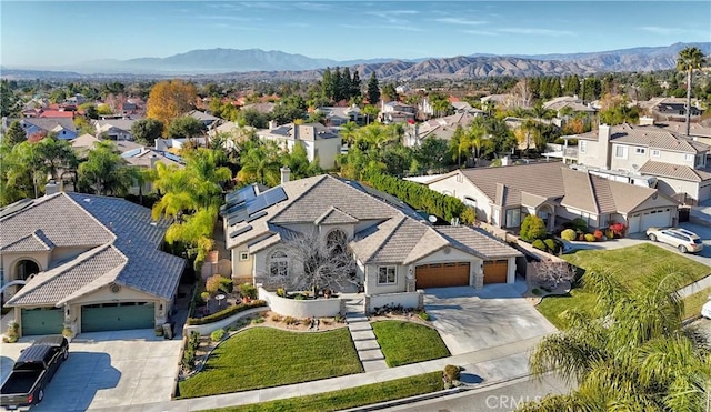 birds eye view of property featuring a mountain view