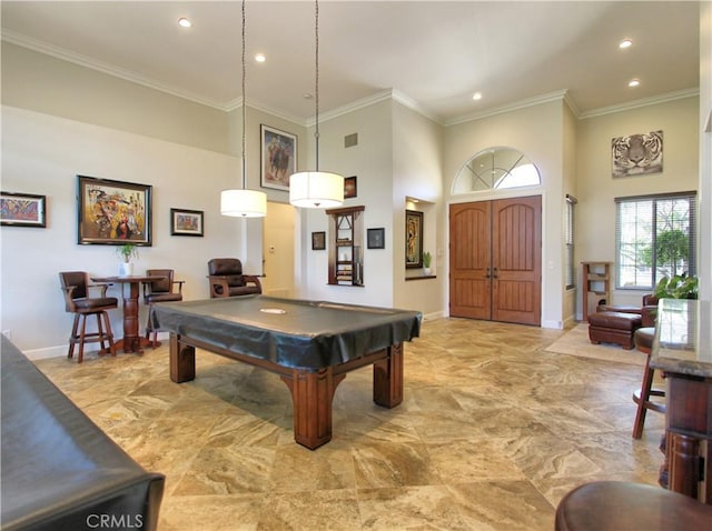 playroom with ornamental molding, a high ceiling, and pool table