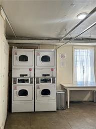 laundry room with independent washer and dryer and stacked washer / drying machine