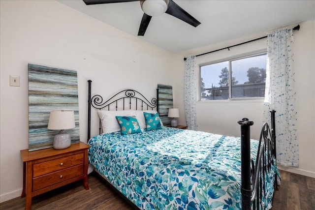 bedroom with ceiling fan and dark hardwood / wood-style floors