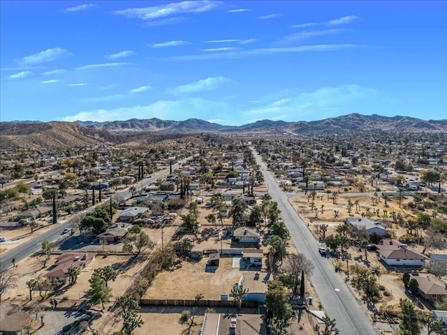 birds eye view of property featuring a mountain view