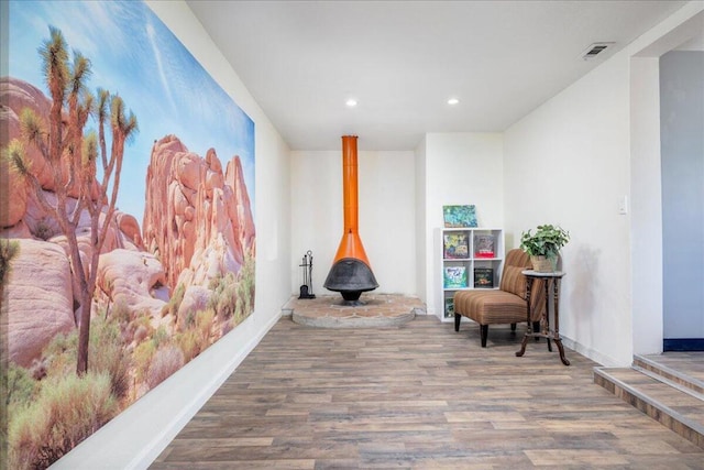 sitting room with hardwood / wood-style floors