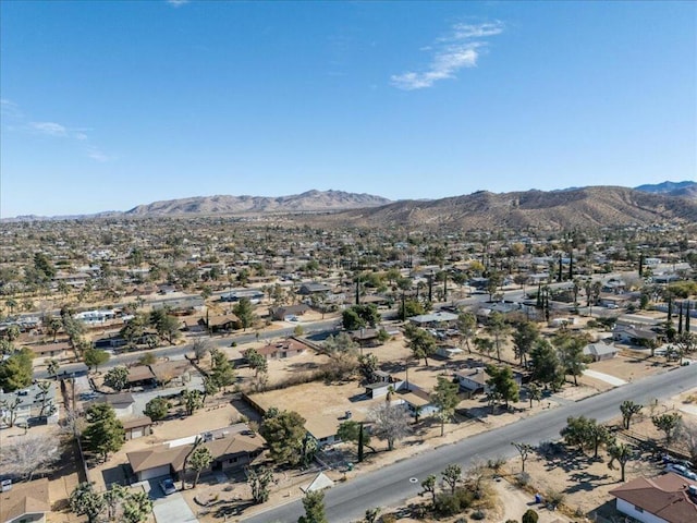 birds eye view of property with a mountain view