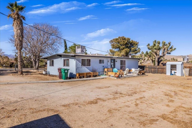 view of front facade with a shed