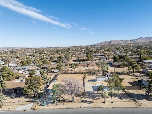 birds eye view of property with a mountain view