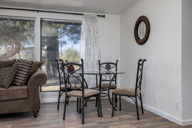 dining room with hardwood / wood-style flooring