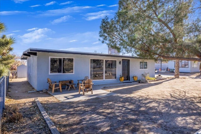 rear view of house with a patio area