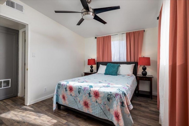 bedroom with ceiling fan and dark hardwood / wood-style floors