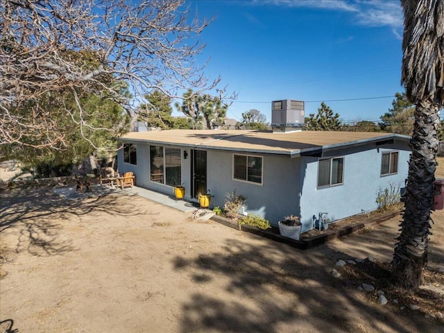 back of house featuring a patio area