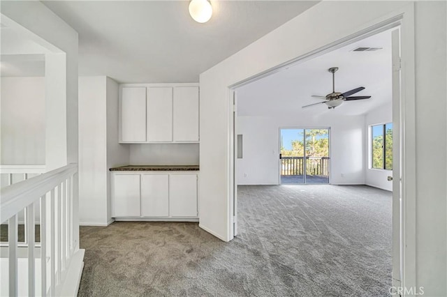 interior space featuring ceiling fan