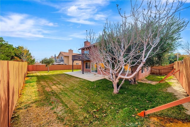 view of yard featuring a patio area and a fenced backyard