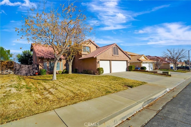 view of front of house with a garage, driveway, a tile roof, a front yard, and stucco siding