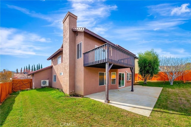 rear view of property featuring ac unit, a yard, a patio, stucco siding, and a fenced backyard